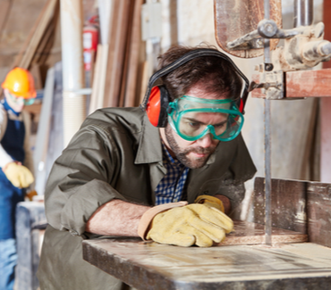 Carpenter using a band saw